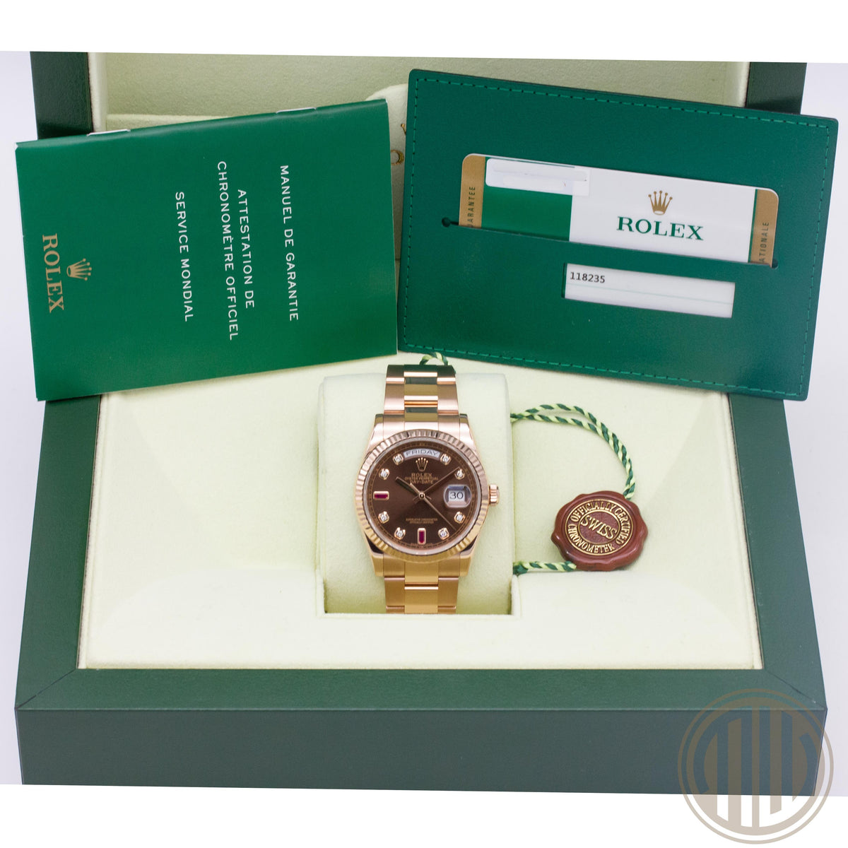 Rolex Day-Date 36 | 18 Karat Roségold | Ruby Dial | Box and Papers | 2015 | 118235