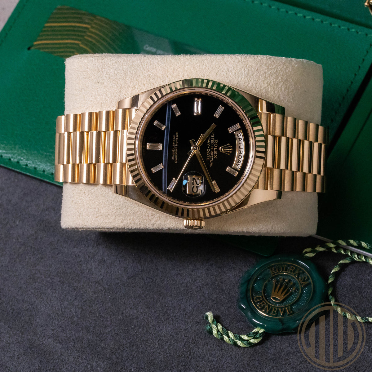 Rolex Day-Date 40 Onyx Baguette Dial | 18kt Yellowgold | Box and Papers | 2023